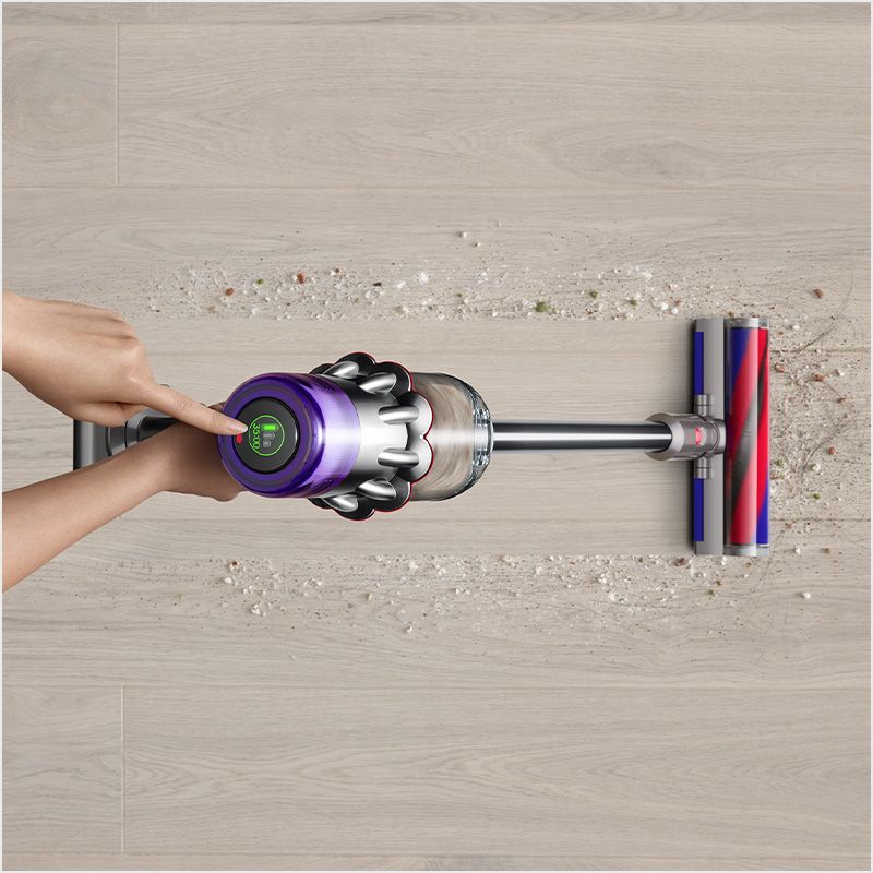 The Dyson Digital Slim vacuum cleans hard floors in a home with the fluffy cleaner head.