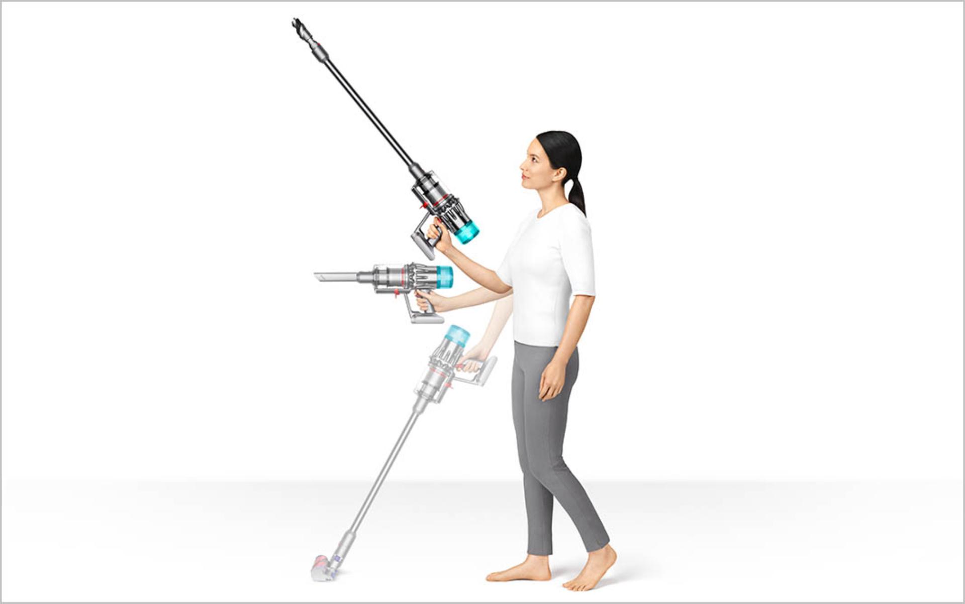 Picture of a woman cleaning up high and using the vacuum in handheld mode.