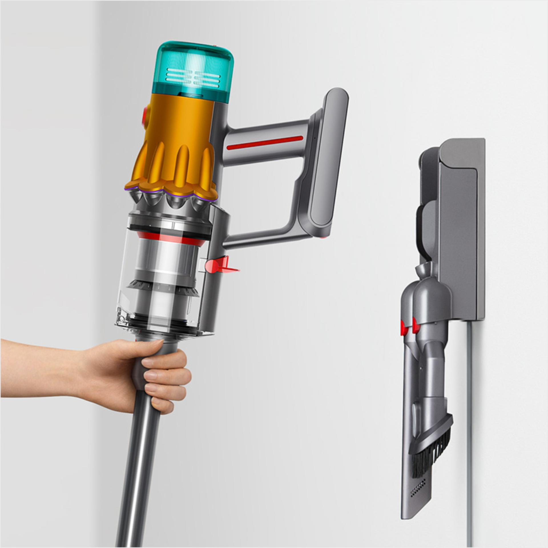 Vacuum being placed in its wall dock.