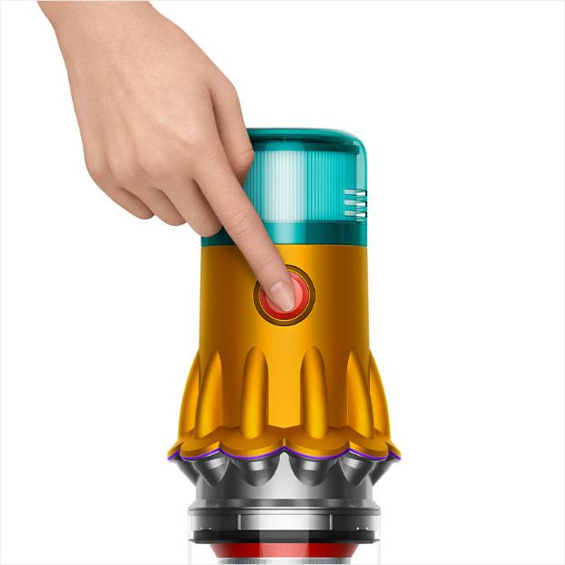 A hand pressing the power button of the V12s.