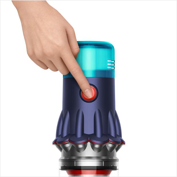 A hand pressing the power button of the V12s.