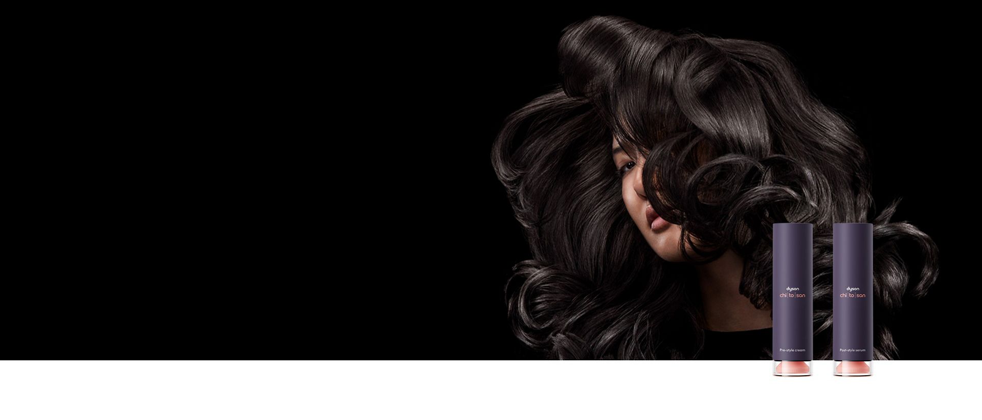 A dark haired model behind the Dyson Chitosan styling range.