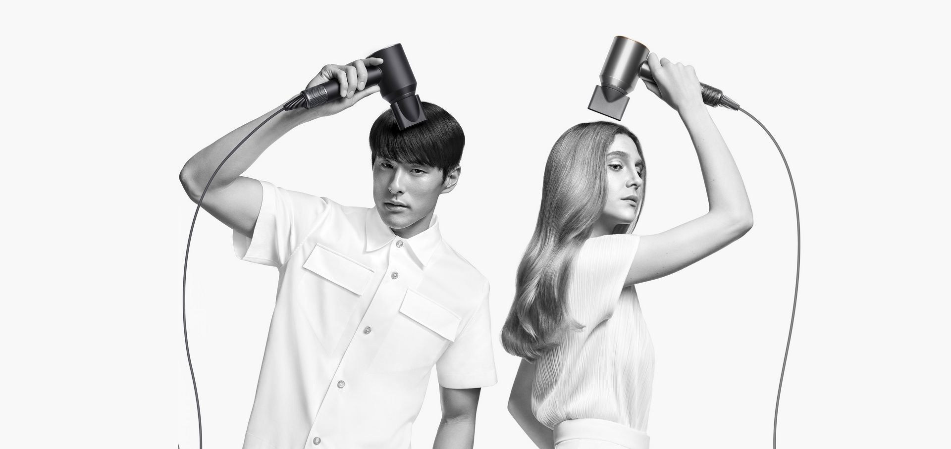 Three models with different hair types using different attachments to style their hair.