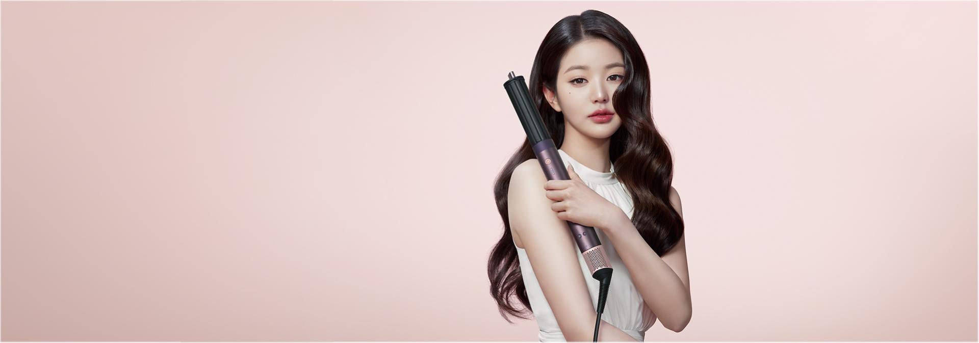 The Dyson Airwrap Co-anda2x multi-styler and dryer with the Airsmooth2x attachment.