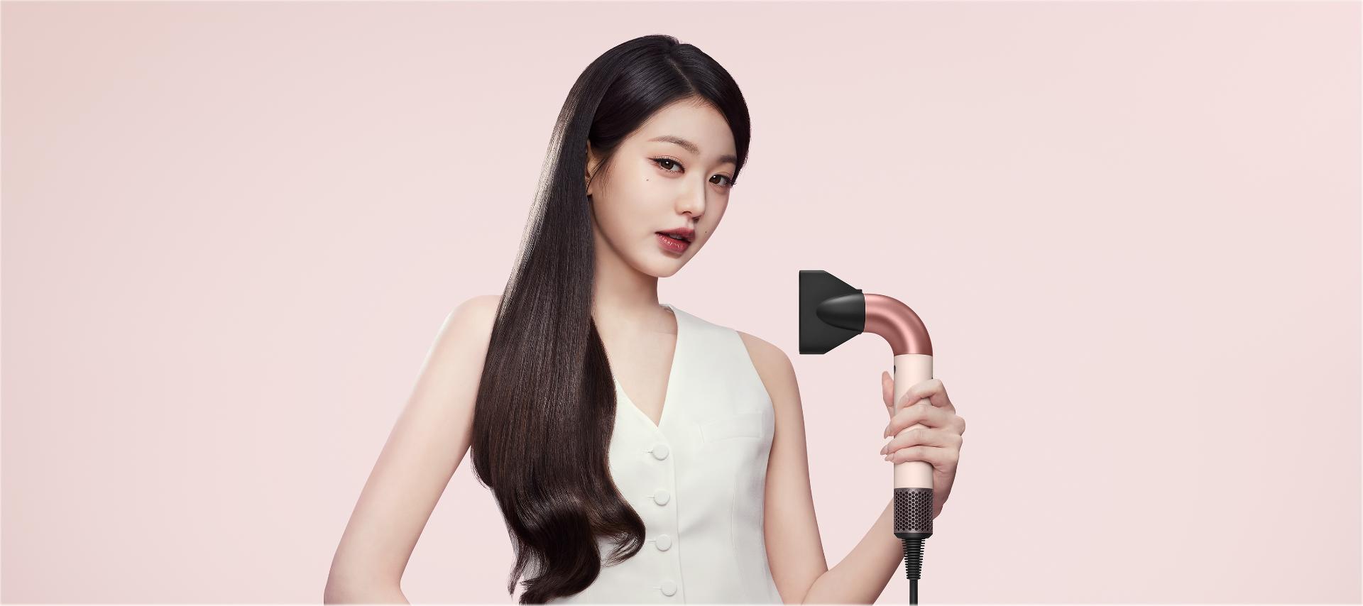 Model and Dyson Supersonic r hair dryer