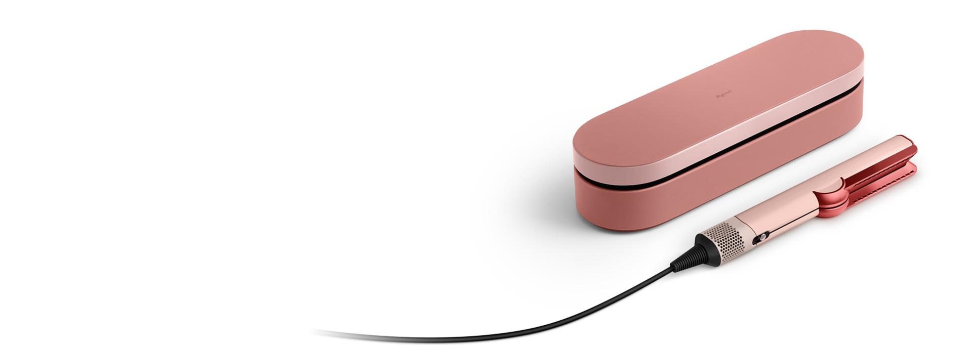 The Dyson Airstrait straightener and Presentation case in the Kanzan Pink colourway.