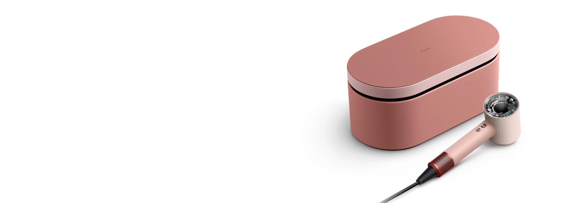 The Dyson Supersonic Nural hair dryer and Presentation case in the Kanzan Pink colourway.