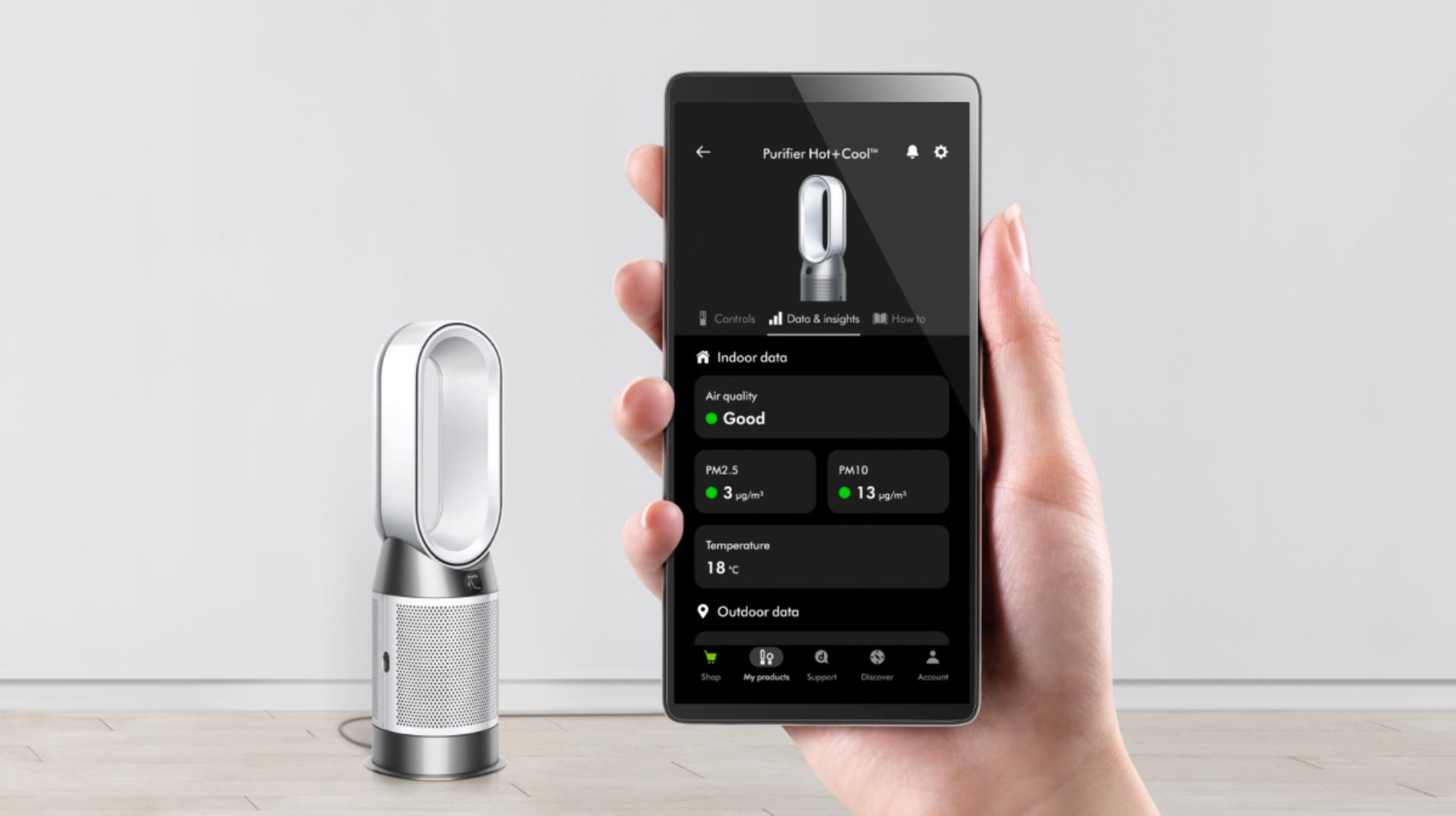 The remote control stored on the top of a Dyson purifier.