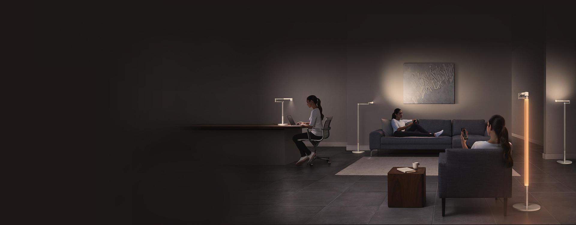 2 models using Dyson Lightcycle desk to work