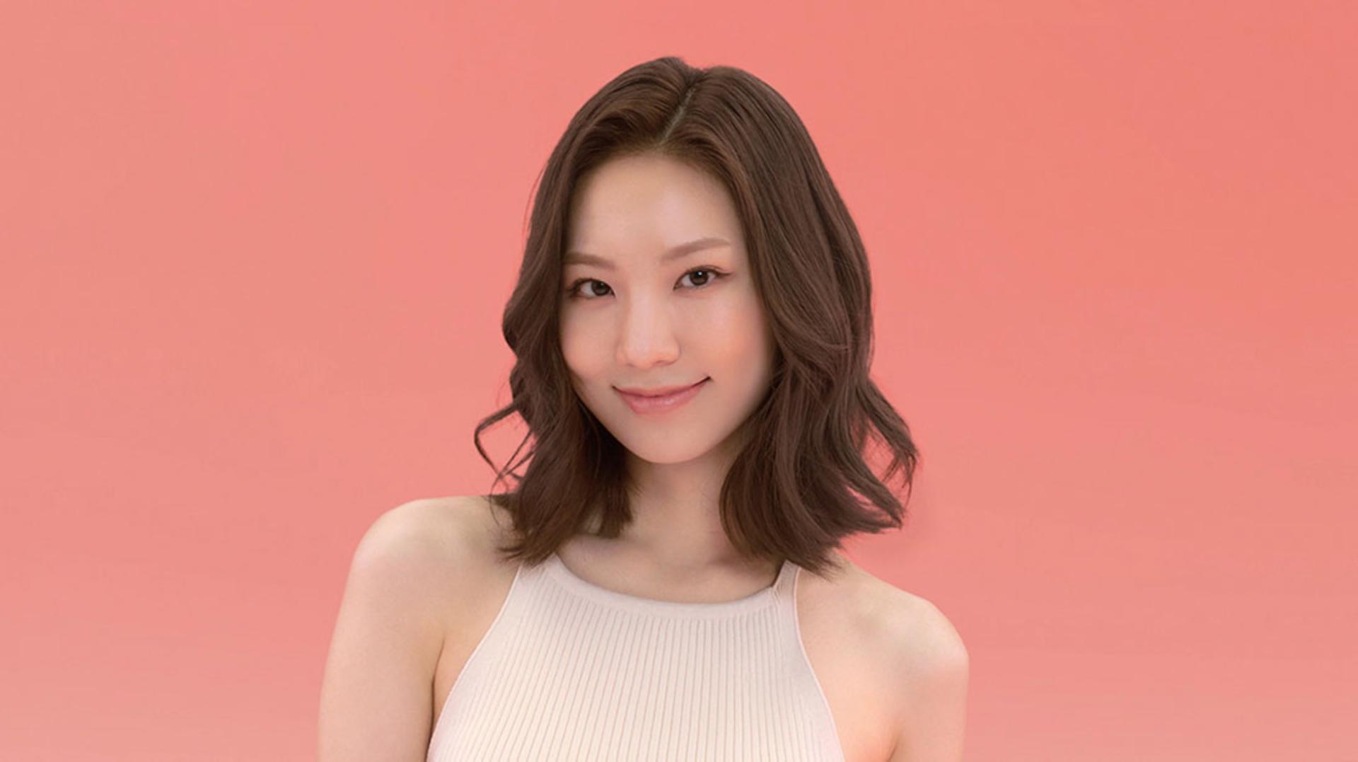 Model wearing a voluminous curly style