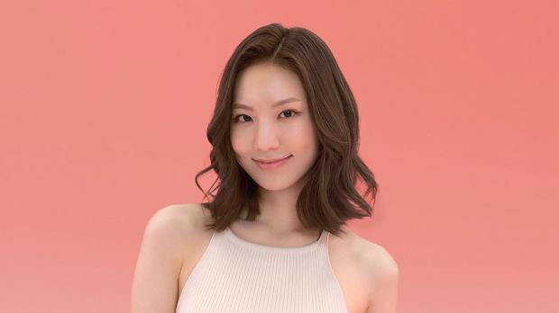 Model wearing a voluminous curly style