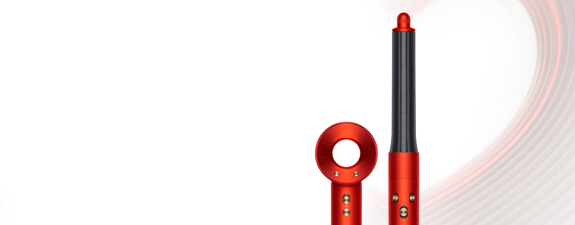 Dyson Supersonic and Dyson Airwrap Complete Long in Topaz orange, on a heart-design background.