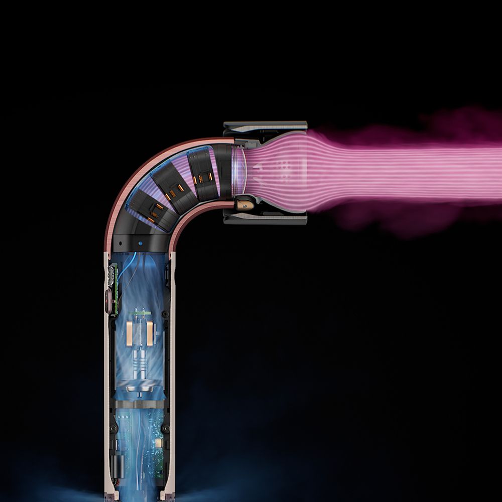 Model with long dark hair styled with the Dyson Supersonic Nural hair dryer.