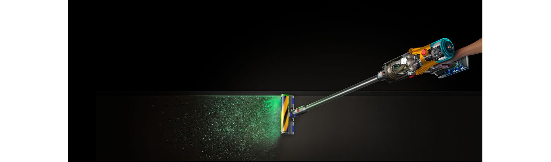 The Dyson V12s Detect Slim Submarine wet and dry vacuum cleaner illuminates and cleans dust from a hard floor.