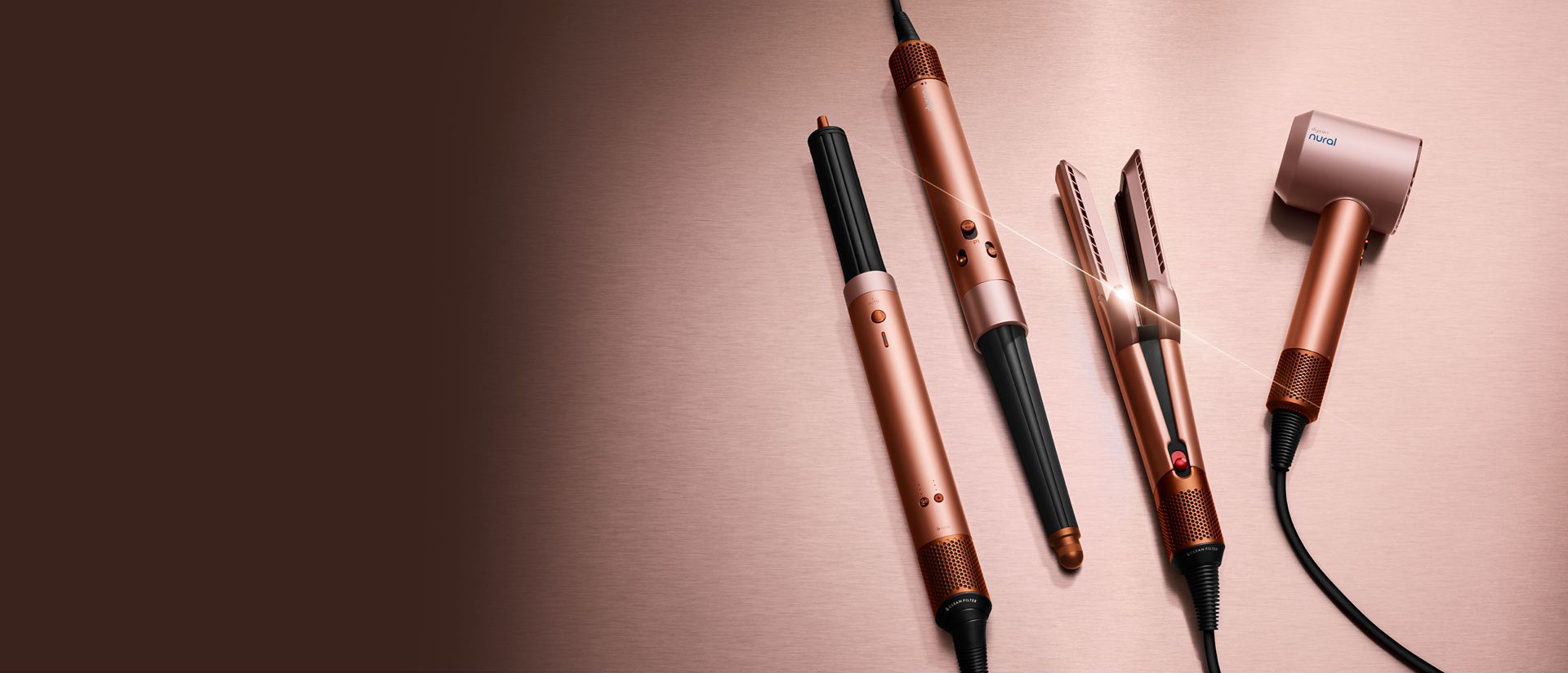 The Dyson Beauty device range in Amber silk colourway.