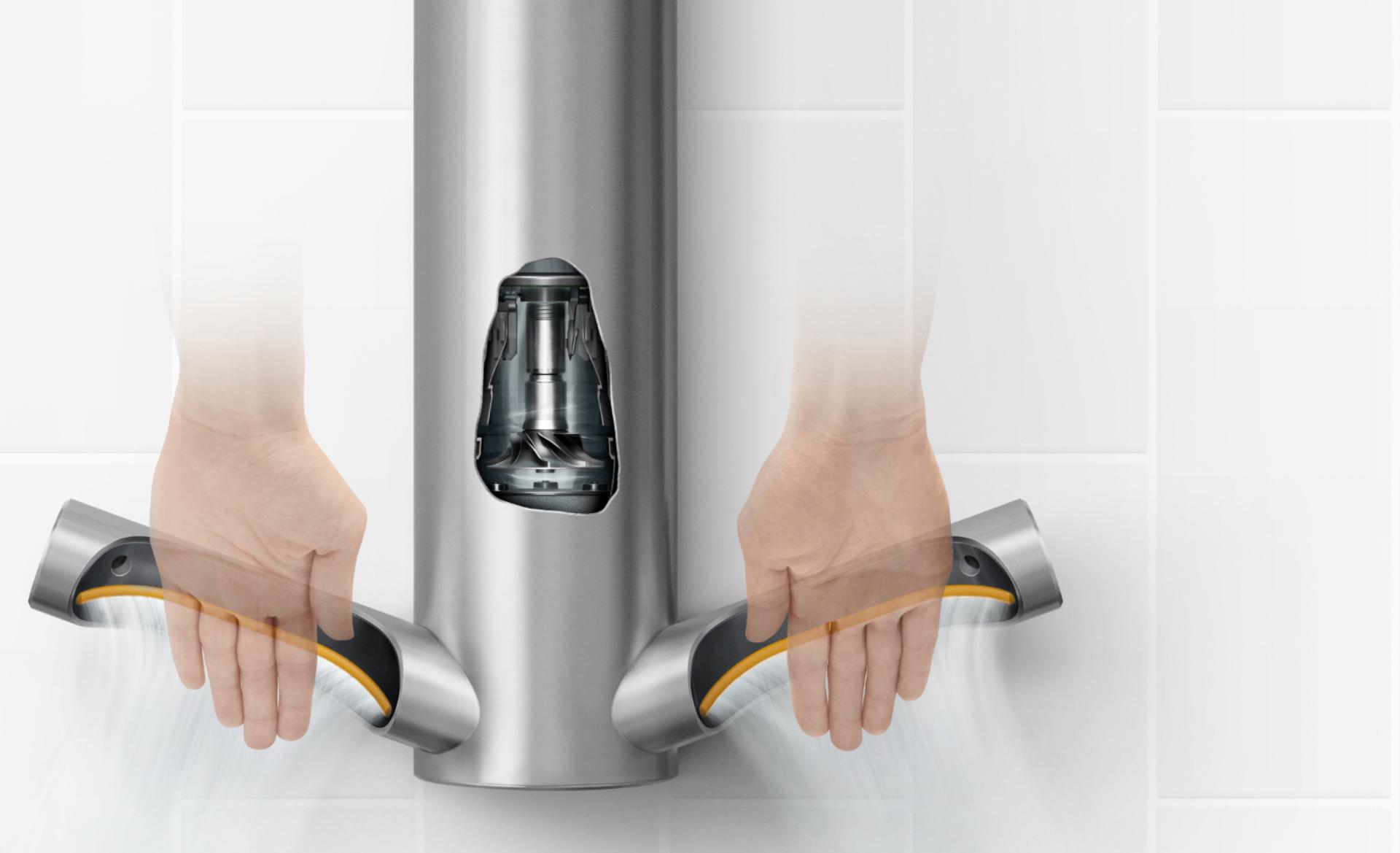 Model standing next to Dyson Airblade 9kJ hand dryer