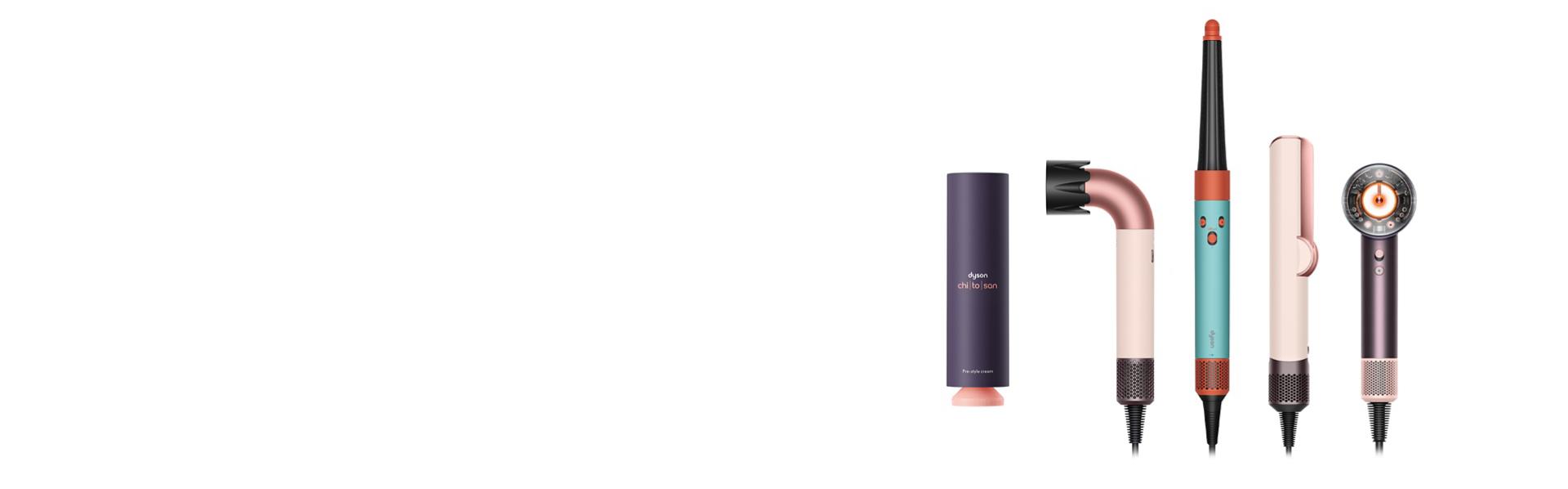Zestaw urządzeń i kosmetyków do stylizacji włosów Dyson na białym tle.