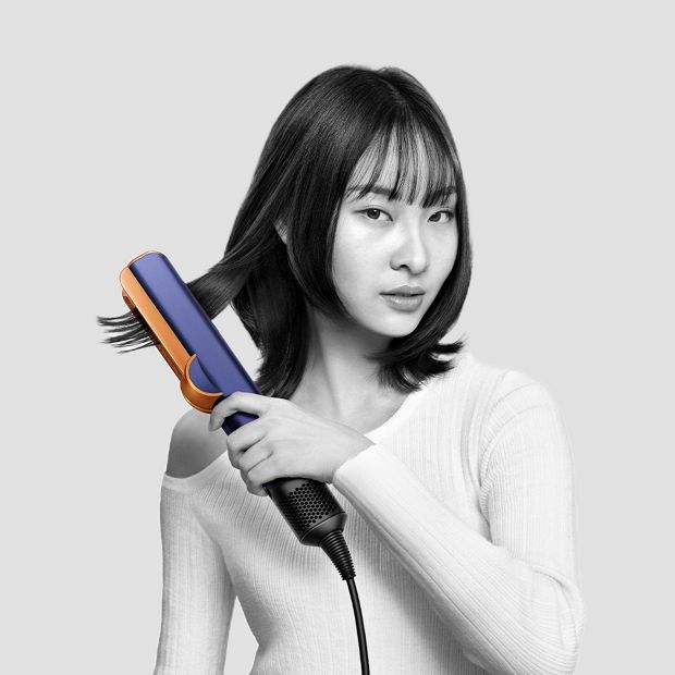 Model using Dyson Corrale straightener