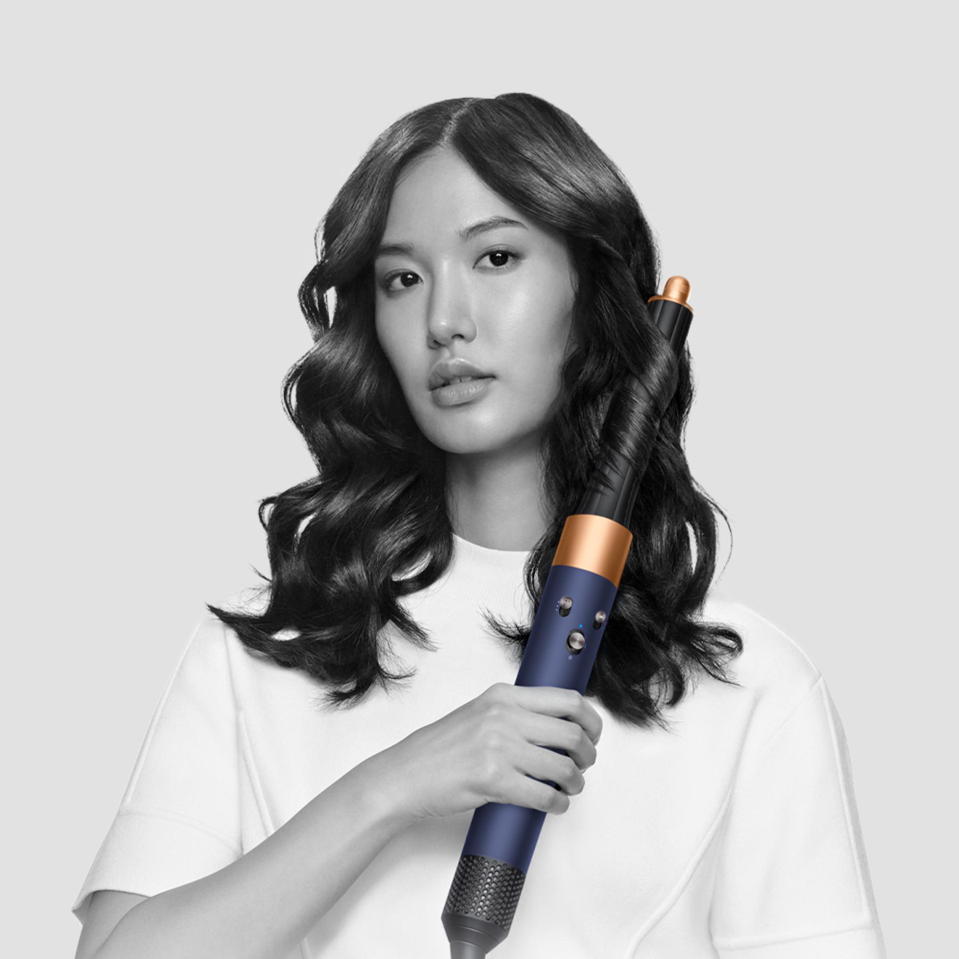 Models using Dyson Airwrap with barrel and Coanda dryer attachments