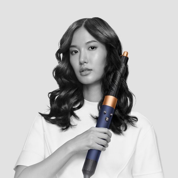 Models using Dyson Airwrap with barrel and Coanda dryer attachments