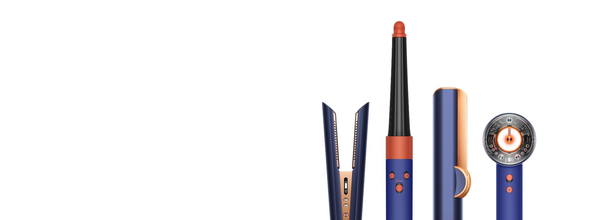 The Dyson Airwrap styler, Supersonic hair dryer, and Corrale straightener on a grey background