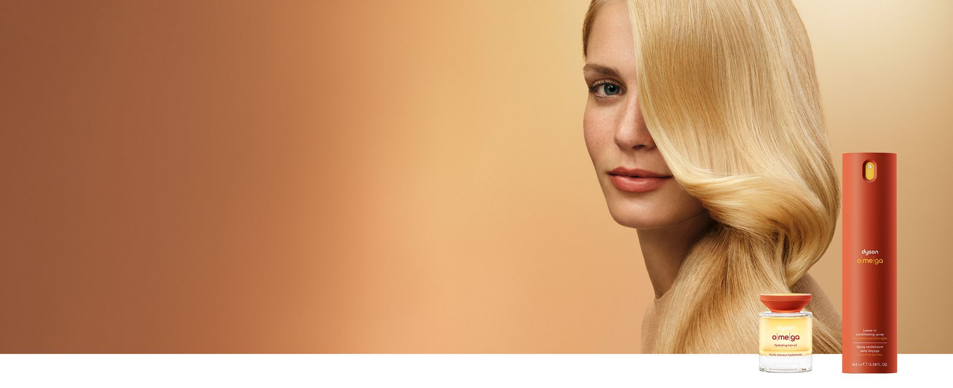 A straight haired model behind the Dyson Omega hair care range.