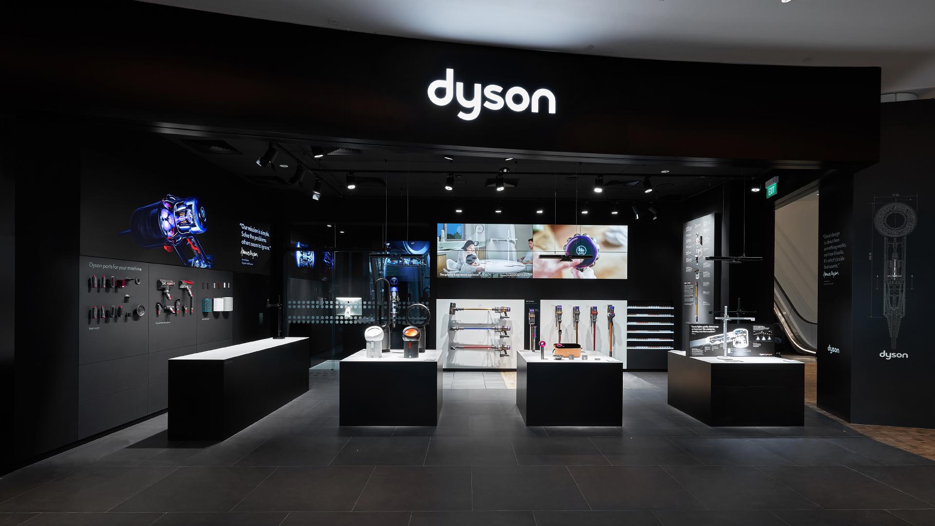 Dyson Demo Store storefront with bike and car driving past