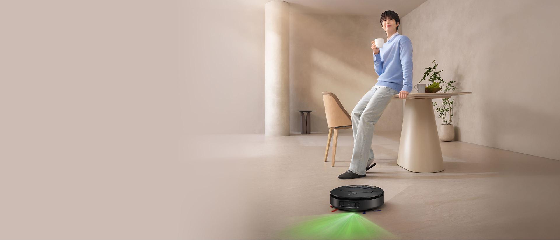 The Dyson Spot+Scrub Ai wet and dry robot vacuum cleaner emits a green light to aid detection of spills and debris.