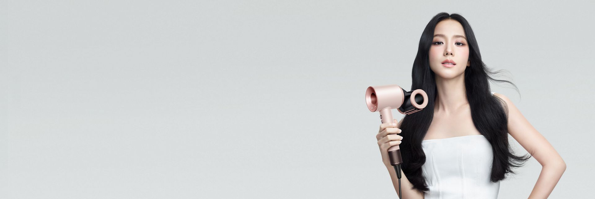 The Dyson Supersonic hair dryer in Ceramic pink and rose gold.