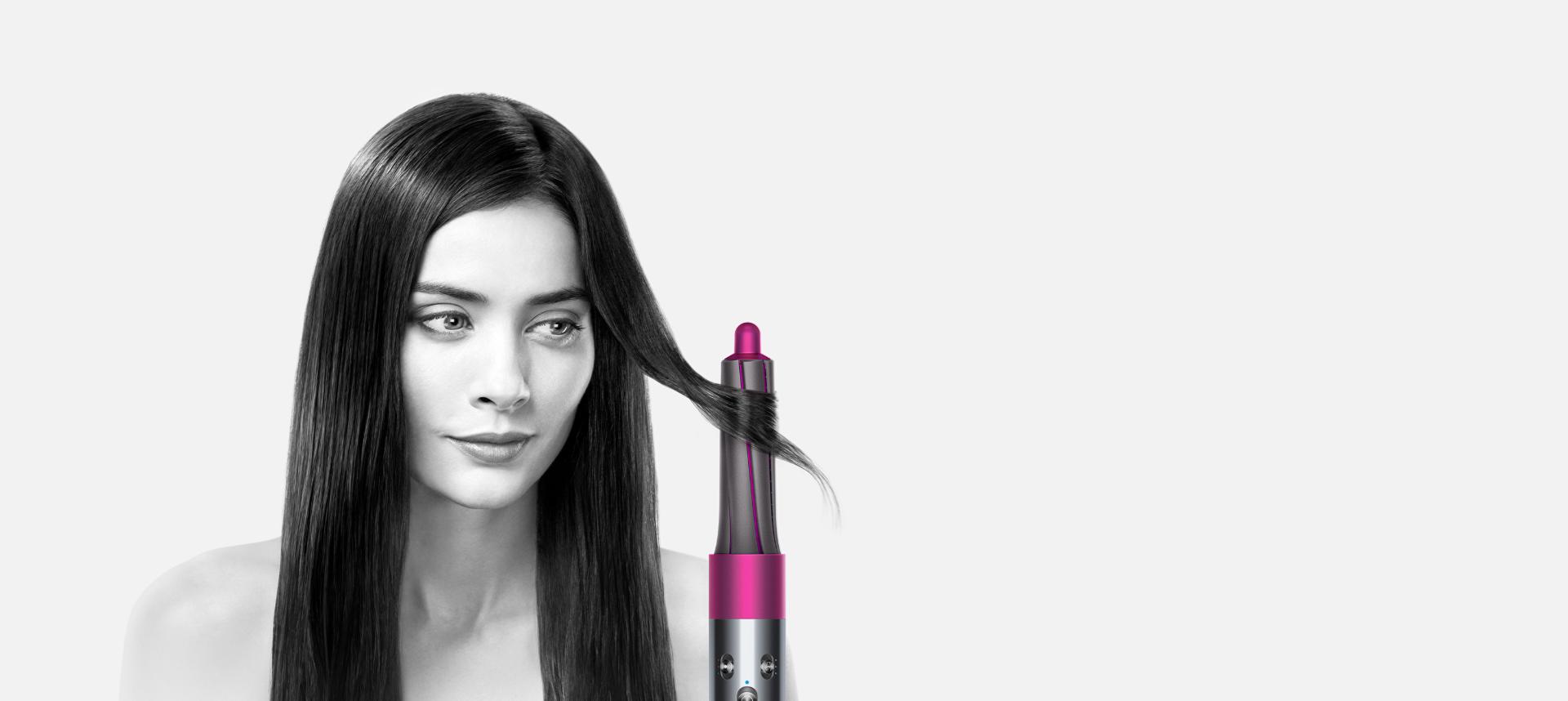 Model demonstrating the Dyson Airwrap™ hair styler on straight hair