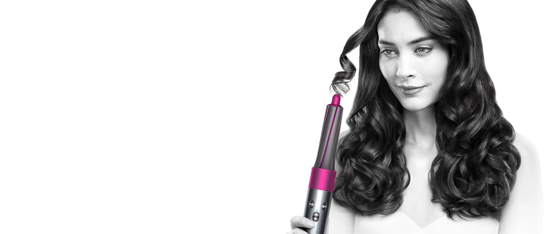 Aerial view of model using Dyson Airwrap™ hair styler
