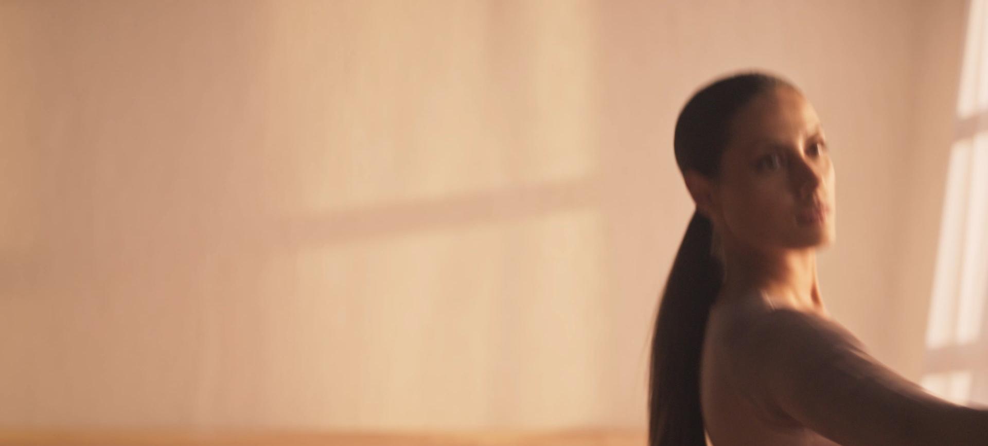 A picture of three women in a row, each with differing hair types of curly, straight, and coily, holding the Dyson Airwrap, Airstrait and Supersonic