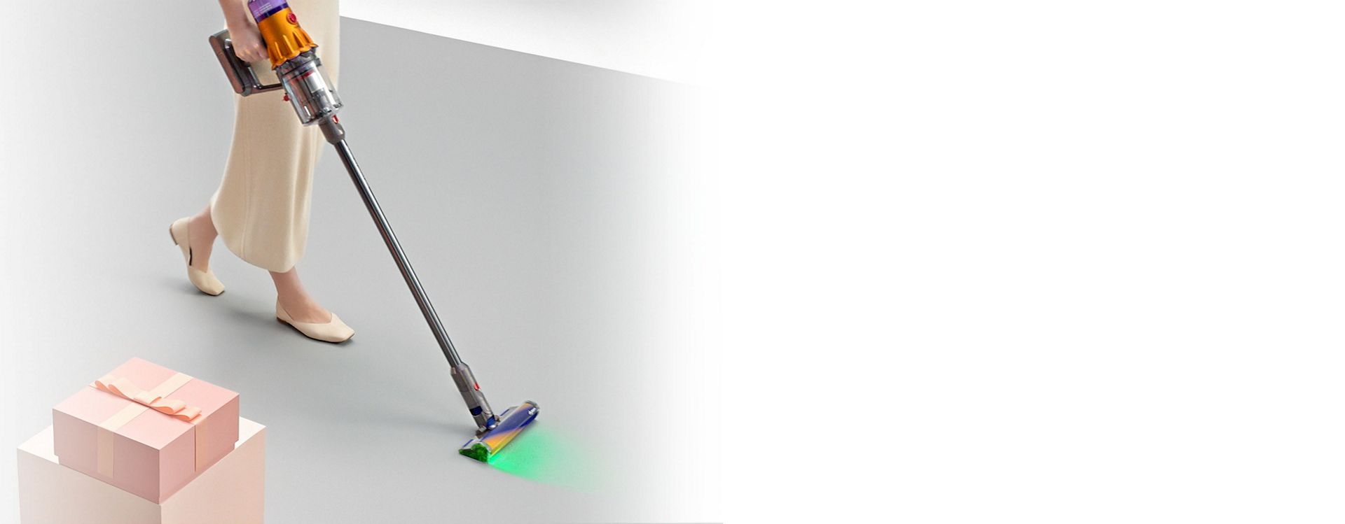 Dyson V12 Detect cordless vacuum used to clean dust and debris from a floor.