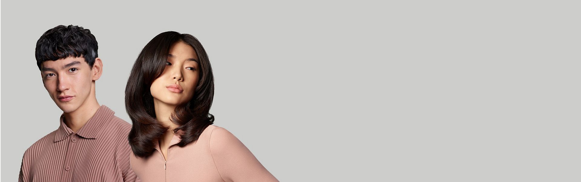 A woman with wavy hair and a man with short blunt hair.