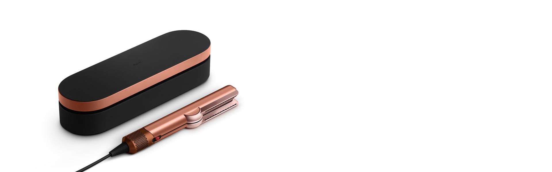 The Dyson Airstrait dryer and straightener with included complimentary gifts.