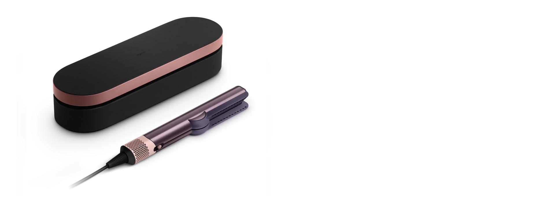 The Dyson Airstrait straightener and Presentation case in the Jasper plum colourway.