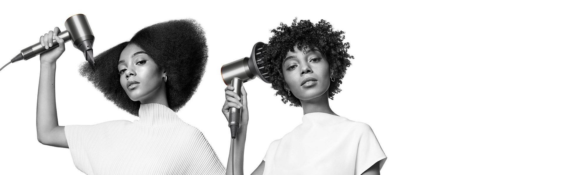 The Dyson Supersonic hair dryer is used by two models to style their curly and coily hair.