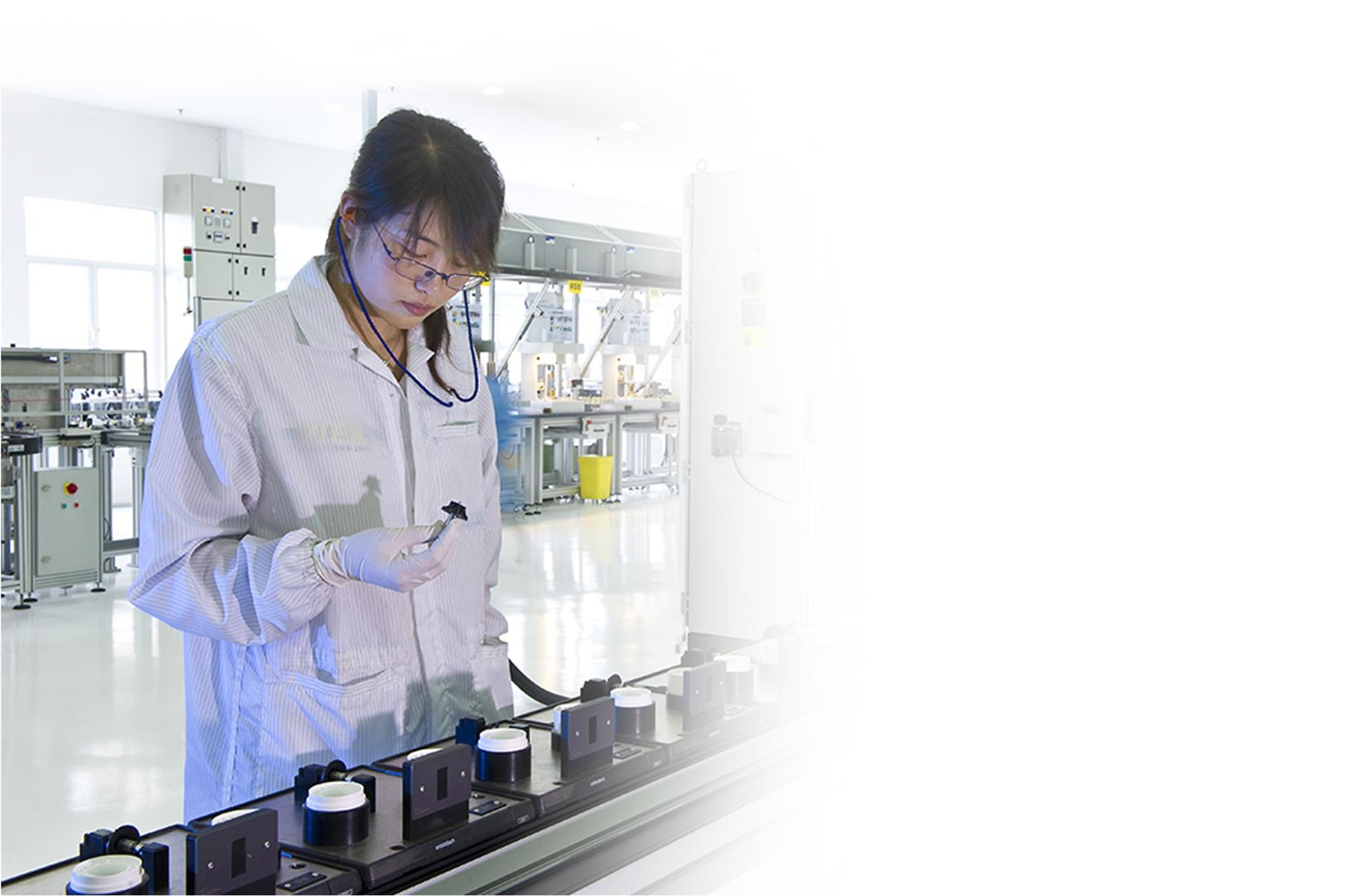 Scientist in laboratory testing parts