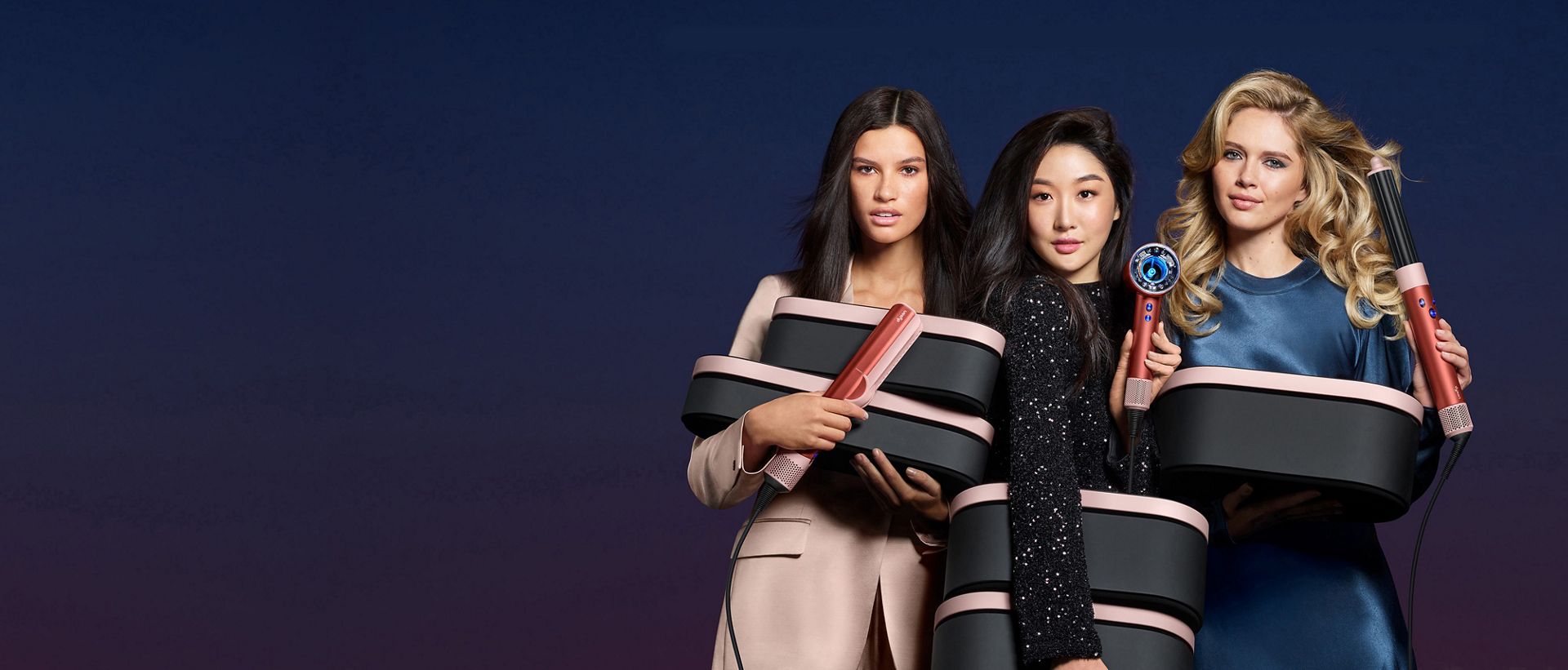 The Dyson beauty range in strawberry bronze and blush pink.