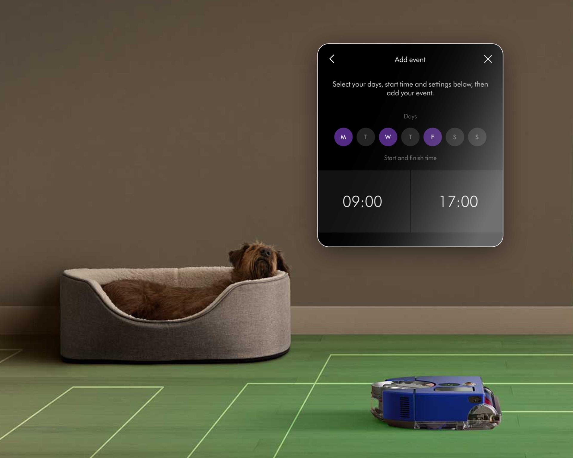 Arka planda bir köpek varken temizlik yapan Dyson 360 Vis Nav robot süpürge.