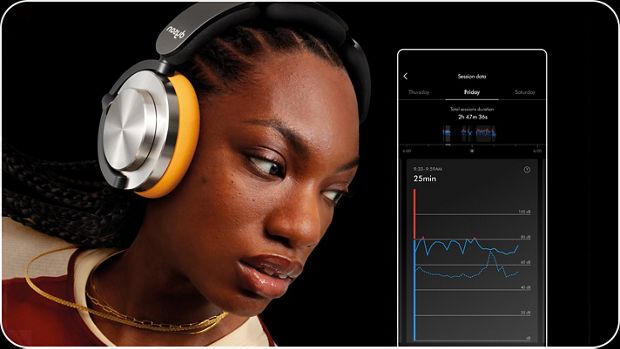 Owner listening to their Dyson OnTrac headphones with the MyDyson app showing how long they've been listening for.