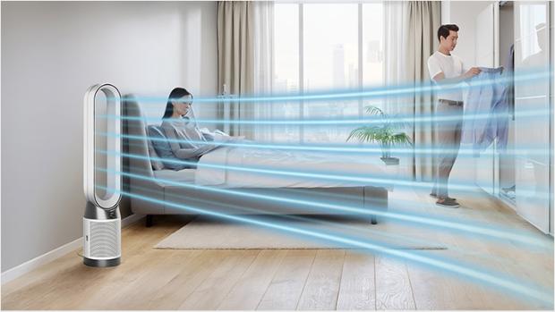 The Dyson Purifier Cool PC1 air purifier delivering a cool breeze with purified air in a bedroom.