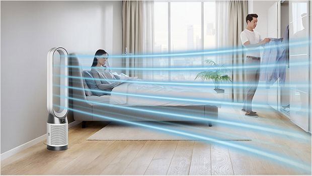 The Dyson Purifier Cool PC1 air purifier delivering a cool breeze with purified air in a bedroom.