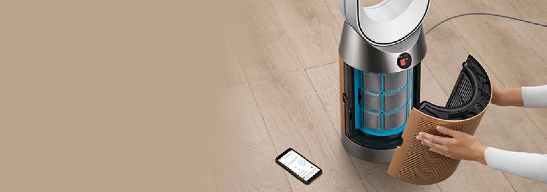 An owner changes the filter of their Dyson purifier after receiving an automatic reminder.