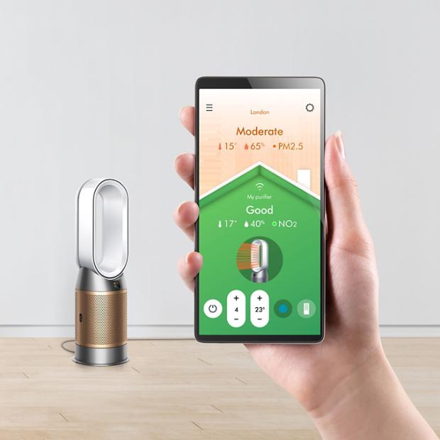 A hand holding a mobile phone with the app home screen displayed