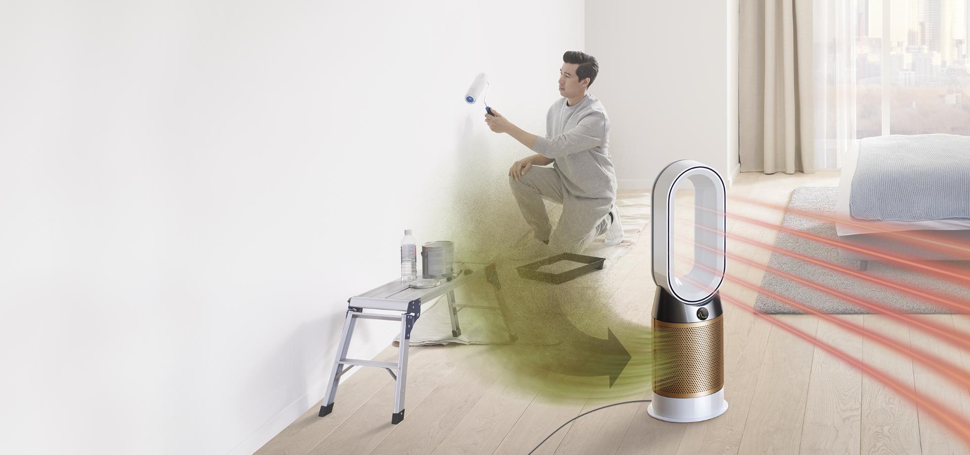 A man paints a room, while formaldehyde gas pollutes the air around him. The Dyson Pure Cryptomic purifier draws in the pollution and projects purified air.