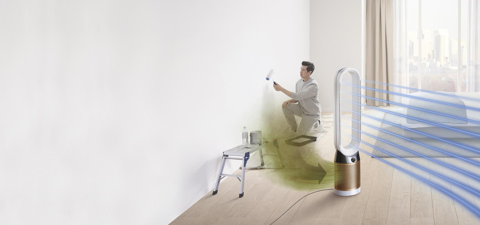 A man paints a room, while formaldehyde gas pollutes the air around him. The Dyson Pure Cryptomic purifier draws in the pollution and projects purified air.