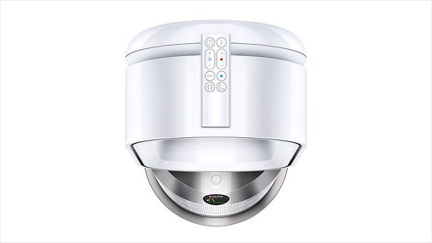 The remote control stored on the top of a Dyson purifier.