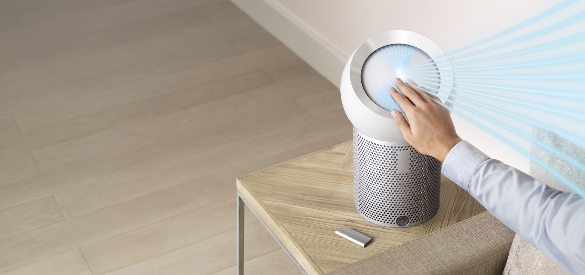 Hand reaching out to refocus airflow with Dyson Core Flow technology
