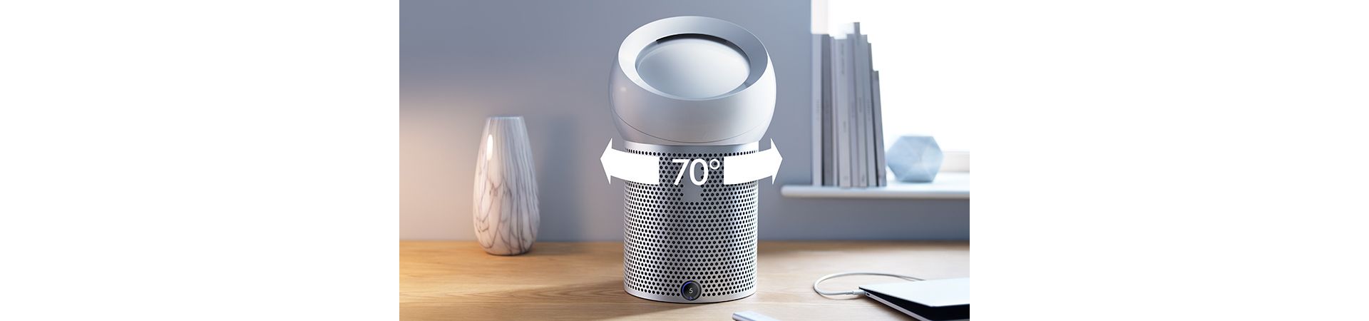 Airflow travels through the Dyson personal purifier fan's apertures, on each side of the convex dome. The jets of air meet and a high-pressure core forms. Purified air coalesces and is projected from the Dyson Pure Cool Me.